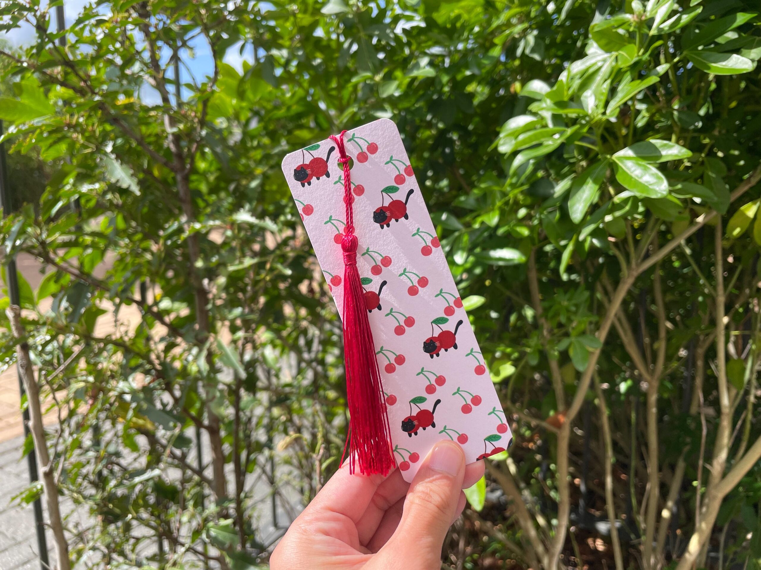 cat cherry bookmark – whimsical tassel design cat cherry bookmark – whimsical tassel design
